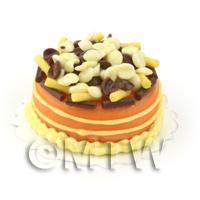  Miniature Caramel Cake Topped With Milk and White Chocolate