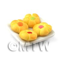 Miniature Mixed Flower Biscuits On A Square Plate