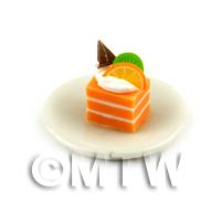 Miniature Orange And White Square Cake Slice Topped With Fruit