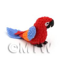 Red Dolls House Miniature Baby Parrot With Multi-Coloured Wings and Blue Tail