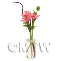 4 Miniature Pink Cut Flowers in a Glass Vase 
