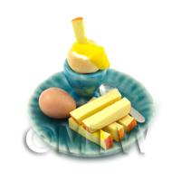 Dolls House Miniature Boiled Egg Being Dipped On A Blue Plate