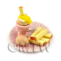 Dolls House Miniature Boiled Egg Being Dipped On A Pink Plate
