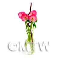 4 Miniature Long Stemmed Tropical Flowers in a Glass Vase