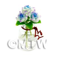 3 Miniature White And Blue Roses in a Short Glass Vase