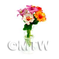 6 Miniature Mixed Flowers in a Curved Glass Vase