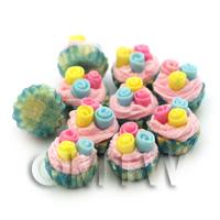 Miniature Pastel Fondant Roses Cupcake With Blue And Yellow Paper Cup