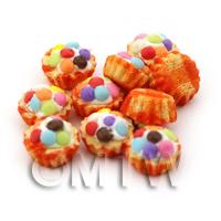 Miniature Smartie Topped Cupcake With A Orange Paper Cup