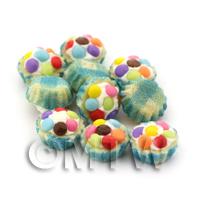 Miniature Smartie Topped Cupcake With A Blue Paper Cup