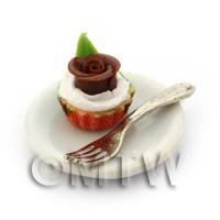 Miniature Chocolate Rose Cupcake In An Orange Cup On A Plate With A Fork