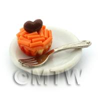 Miniature Orange Sprinkle Cupcake In An Orange Cup On A Plate With A Fork