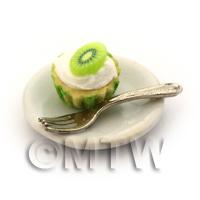 Miniature Kiwi Cream Cupcake In A Green Paper Cup On A Plate With A Fork