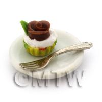 Miniature Chocolate Rose Cupcake In A Green  Yellow Cup On A Plate With A Fork
