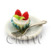 Miniature Strawberry Cream Cupcake In A Blue Paper Cup On A Plate With A Fork