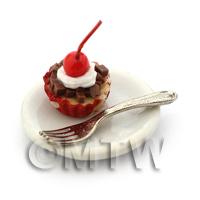 Miniature Chocolate Cherry Cupcake In An Red Paper Cup On A Plate With A Fork