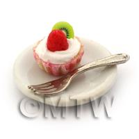 Miniature Strawberry And Kiwi Cupcake In A Pink Paper Cup On A Plate With A Fork