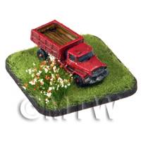 a red painted Zil 131 Open Back Lorry on grass