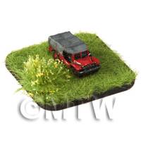 a red painted Dodge Load Carrier Jeep on grass
