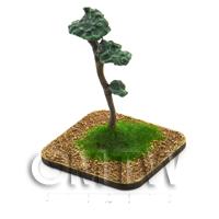 a painted Scots Pine Tree on a grass and earth base