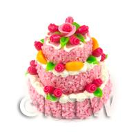 Pink Iced Miniature 3 Tier Celebration Cake Finished with Fondant Roses 