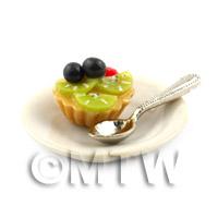 Dolls House Black Cherry and Kiwi Tart on a Plate With a Spoon