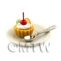 Dolls House Orange and Kiwi Tart on a Plate With a Spoon