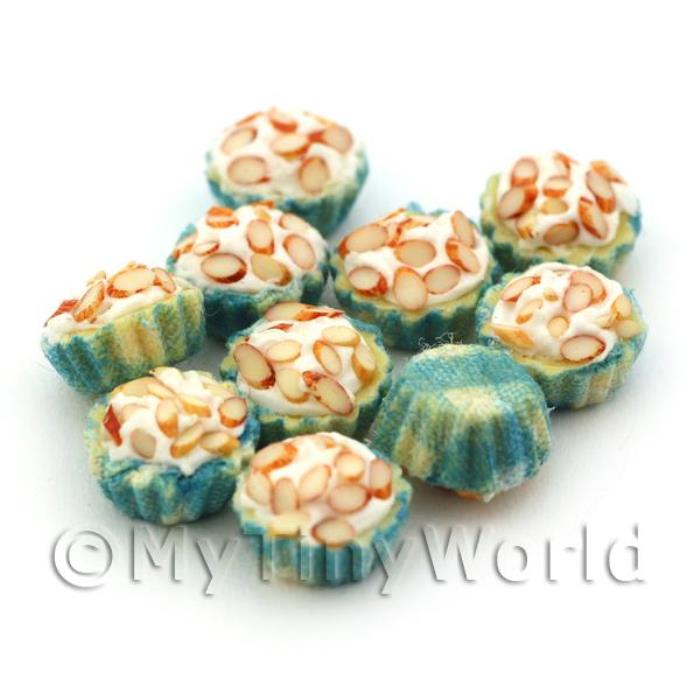 Miniature Chopped Almond Cupcake With A Blue And White Paper Cup