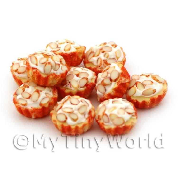 Miniature Chopped Almond Cupcake With A Orange And White Paper Cup
